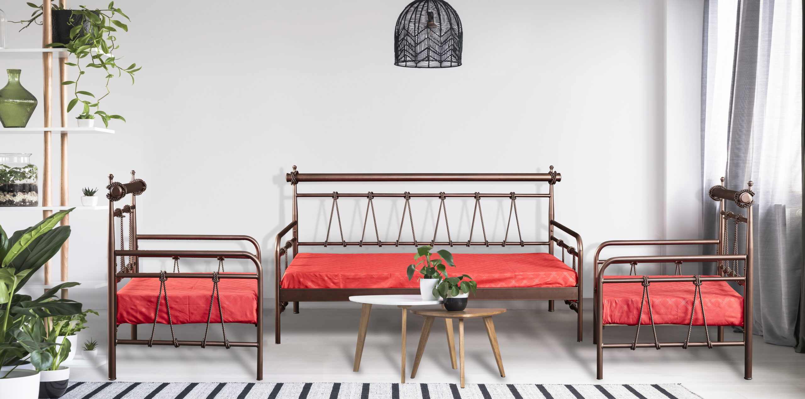 Plant on table in front of red couch in bright living room inter Σαλόνι Biron Νο 34Α (Τριθέσιος Καναπές-Κρεβάτι) - Image 1